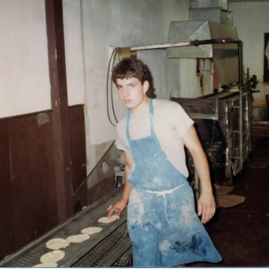 A young Sergio Leal working the tortilla line at Leal's Tortilla Factory in Muleshoe, Texas.